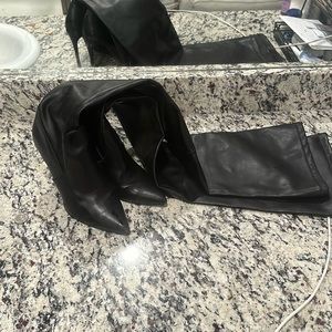 Black thought high boots not in their best condition